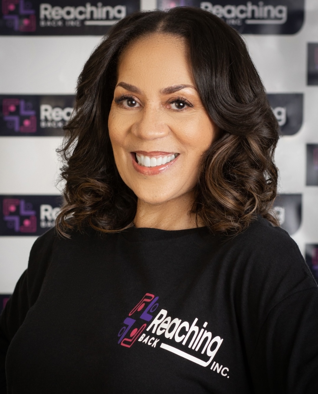 Portrait of Leah Douglas Wooten wearing a Reaching Back, Inc. shirt